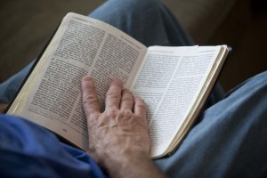 Bruce Boling holds a Bible open while participating in a Bible study group in Gallatin, Tenn. RNS photo by Jeff Adkins