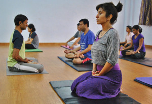 Private yoga instructor Shailendra Singh (far right) leads a group of young professionals at The Yoga Guru club in Noida in Delhi's suburbs. RNS photo by Vishal Arora